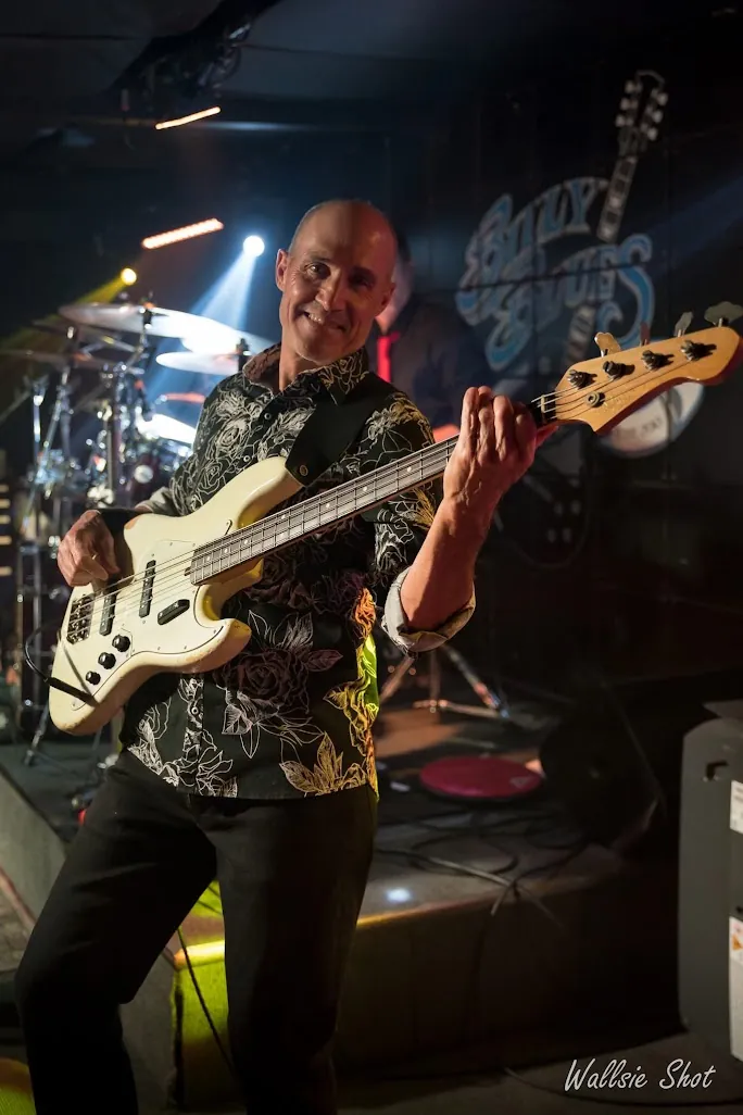 Bassist smiling on stage