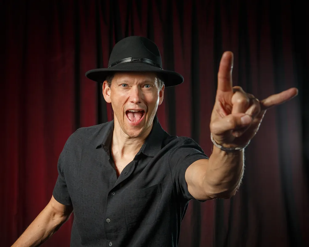 Band member throwing horns